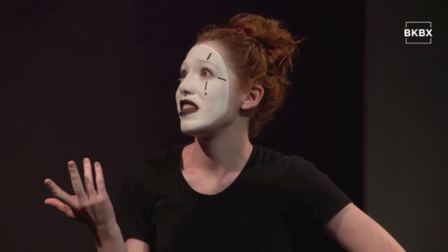 Woman In Black Shirt With White Face Paint GIF