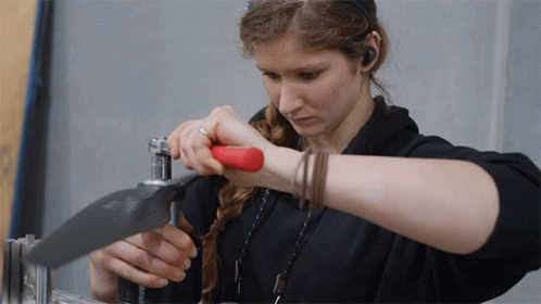 Woman In Black Shirt Working Metal GIF