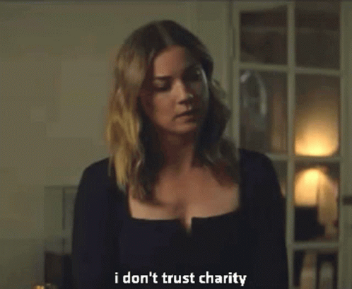 Woman in Black Sweater Saying I Don't Trust Charity