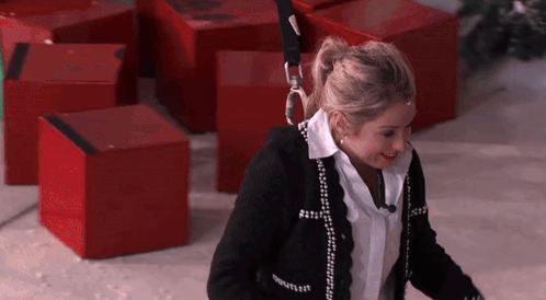Woman In Black Sweater With Chanel GIF