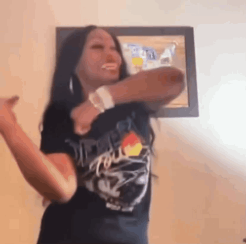 Woman in Black T-Shirt Dancing
