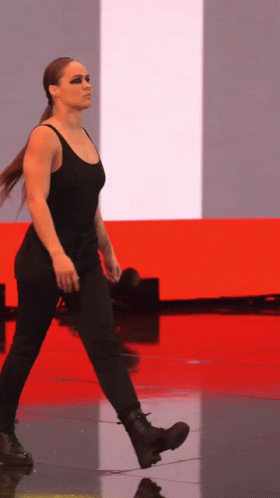 Woman in Black Tank Top and Pants Walking