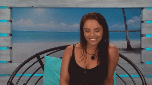 Woman in Black Tank Top at Beach