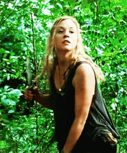 Woman in Black Tank Top Holding Knife