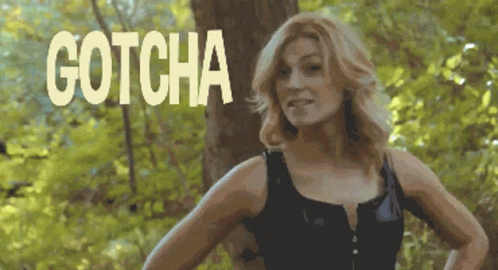 Woman in Black Tank Top in Woods Gotcha