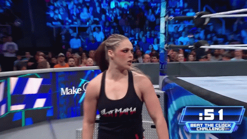 Woman in Black Tank Top in Wrestling Ring