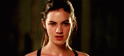 Woman In Black Tank Top Making Funny Face GIF