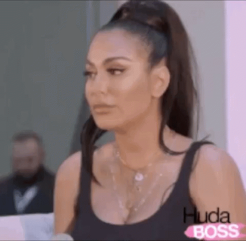 Woman in Black Tank Top Ponytail Making Face