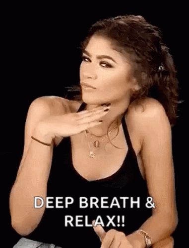 Woman in Black Tank Top Saying Deep Breath Relax