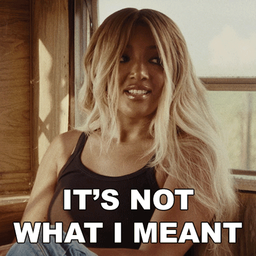 Woman in Black Tank Top Saying Not What I Meant