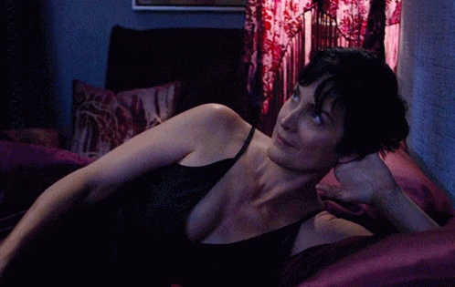 Woman in Black Tank Top Stretching