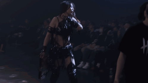 Woman in Black Top and Gloves Dancing