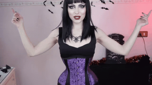 Woman in Black Top and Purple Corset