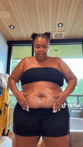 Woman in Black Top and Shorts in Bathroom