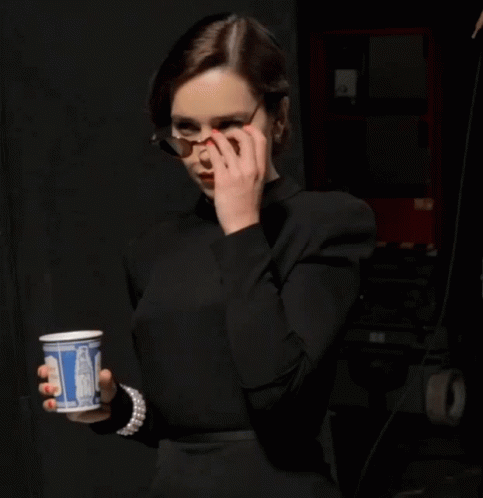 Woman in Black Top Holding Coca Cola Cup