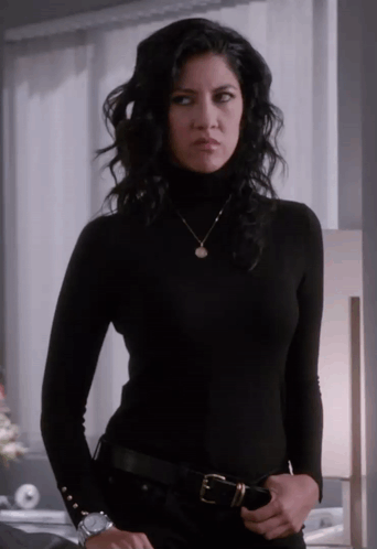 Woman in Black Turtleneck and Necklace