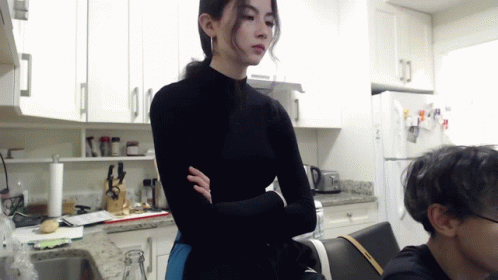 Woman in Black Turtleneck in Kitchen