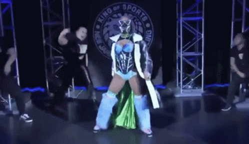 Woman in Blue and Green Outfit in Front of King of Sports Banner