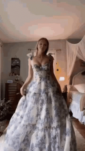 Woman in Blue and White Floral Dress