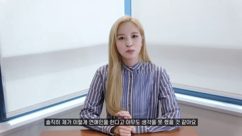 Woman In Blue And White Striped Shirt At Desk GIF