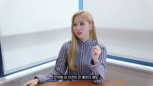 Woman In Blue And White Striped Shirt Sitting GIF