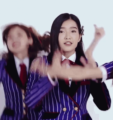 Woman in Blue and White Striped Suit Dancing