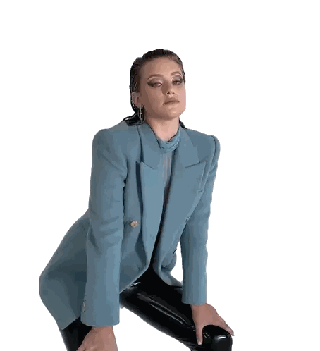 Woman in Blue Blazer and Black Pants Squatting