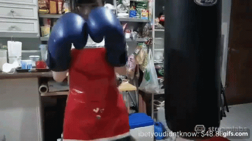 Woman in Blue Boxing Gloves