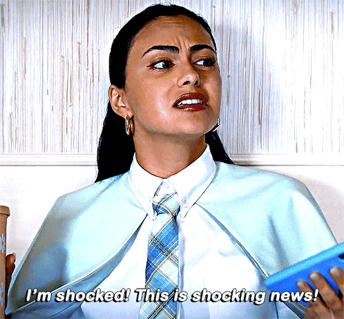 Woman in Blue Cape and Tie Says Shocked