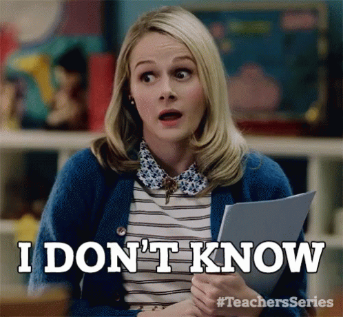 Woman in Blue Cardigan Saying I Don't Know