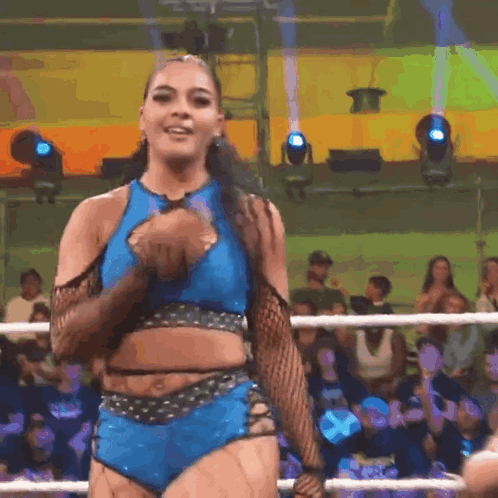 Woman in Blue Crop Top and Shorts in Wrestling Ring