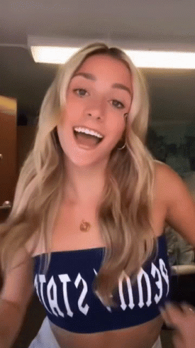 Woman in Blue Crop Top Saying Tat2