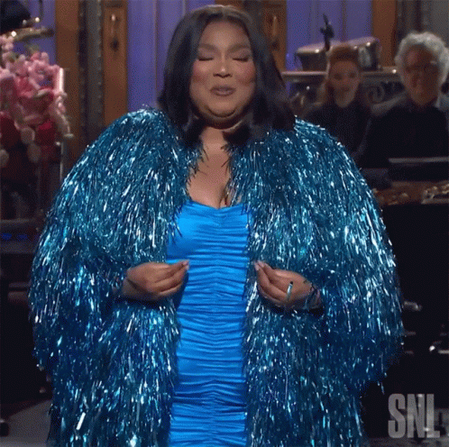 Woman in Blue Dress and Blue Tinsel Coat
