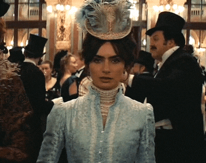 Woman in Blue Dress and Feathered Hat