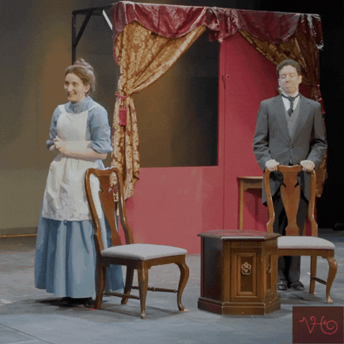 Woman in Blue Dress and Man in Suit Under Canopy