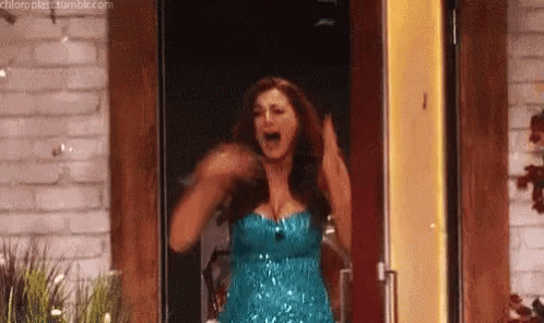 Woman in Blue Dress Arms Up in Doorway