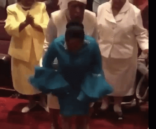 Woman in Blue Dress Dancing in Church with Women