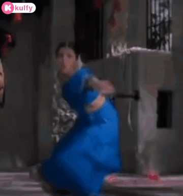 Woman in Blue Dress Dancing