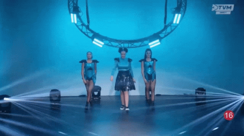 Woman in Blue Dress Dancing on Stage