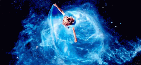 Woman in Blue Dress Floating in Bubble