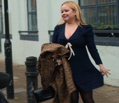 Woman in Blue Dress Holding Fur Coat