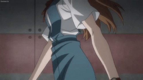 Woman In Blue Dress In Front Of Red Wall Boanime.tv GIF