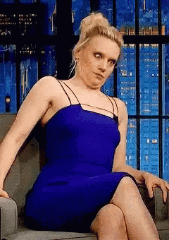 Woman in Blue Dress Making Funny Face