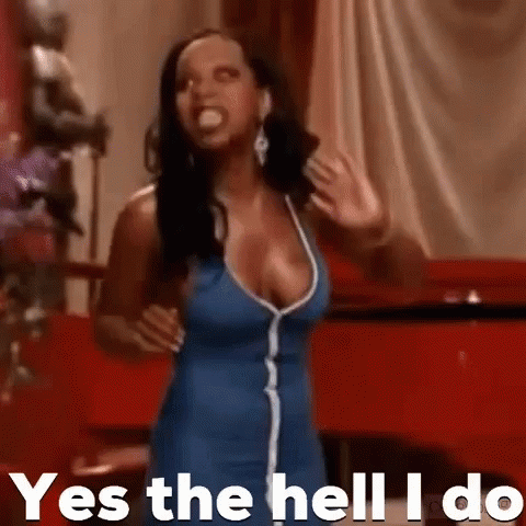 Woman In Blue Dress Making Funny Face GIF