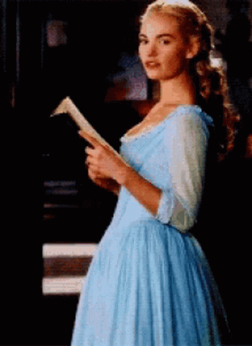 Woman in Blue Dress Reading a Book