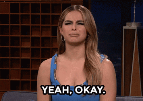 Woman in Blue Dress Saying Yeah Okay