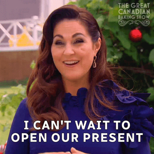 Woman In Blue Dress Says I Can't Wait To Open Our Present GIF