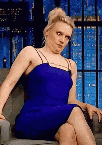 Woman In Blue Dress Sitting Crossed Legs GIF