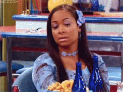 Woman In Blue Dress Sitting With Blue Bottles And French Fries GIF
