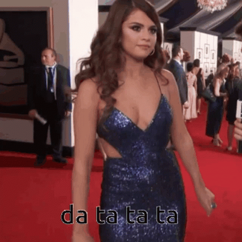 Woman in Blue Dress Walking on Red Carpet Da Ta Ta Ta